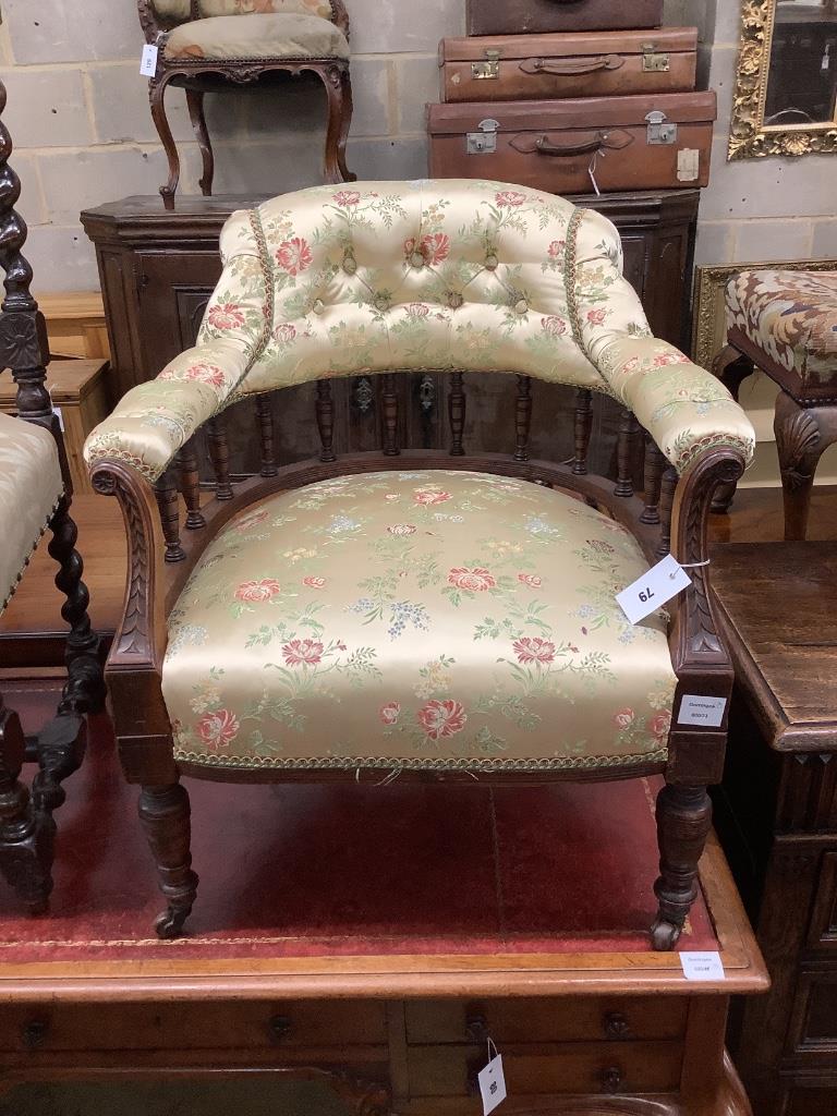 An Edwardian walnut tub chair and a vineous carved dining chair